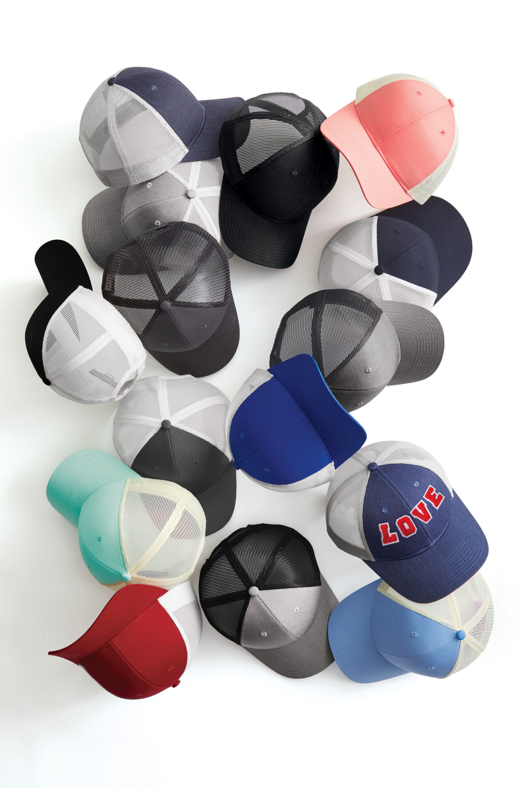 Variety of colorful caps arranged creatively.